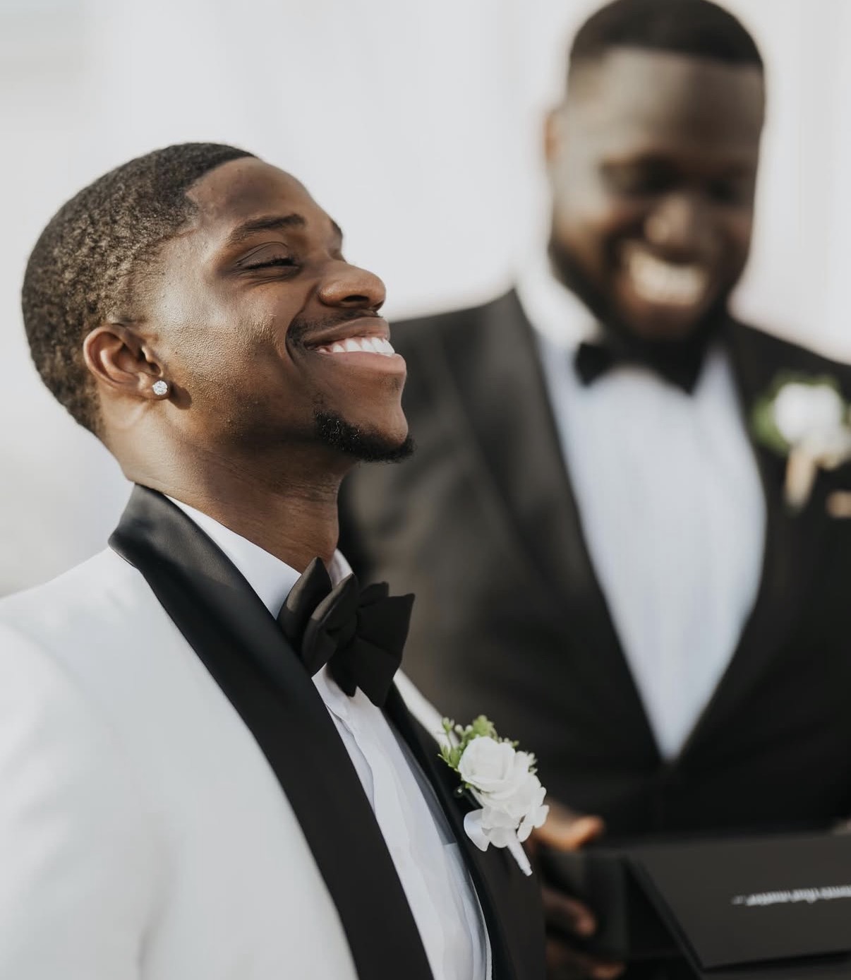 Groom laughing during the ceremony
