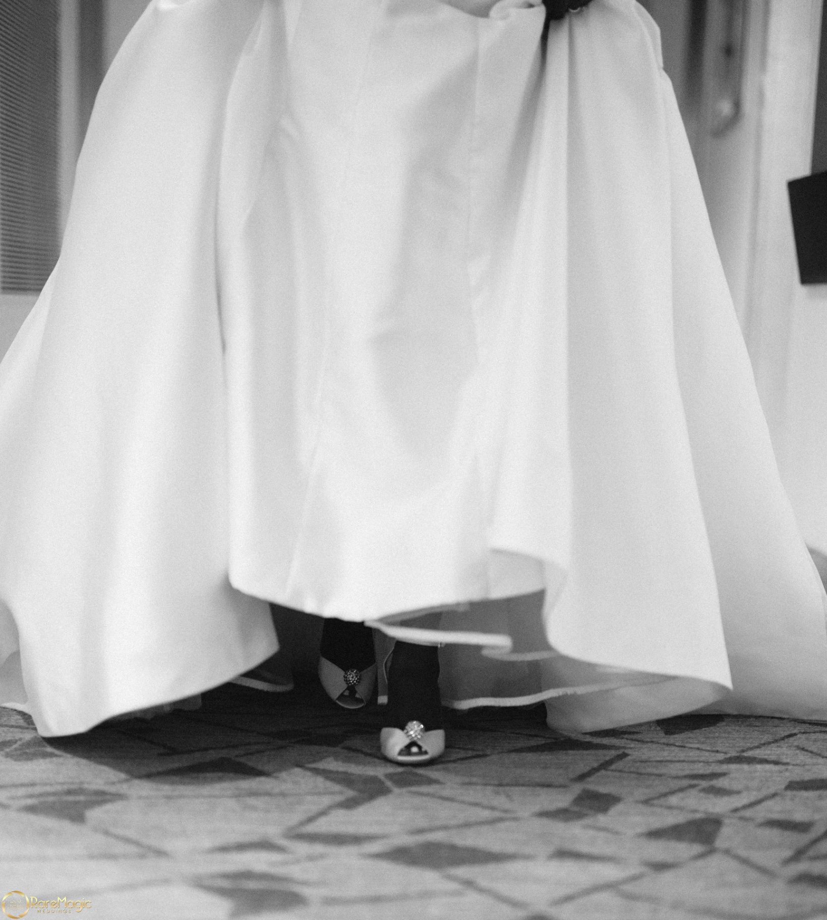 Detail of the bride's gown and embellished heels