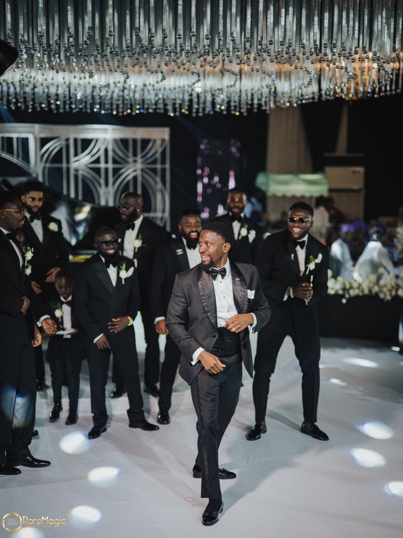 Groom with his groomsmen entering the reception