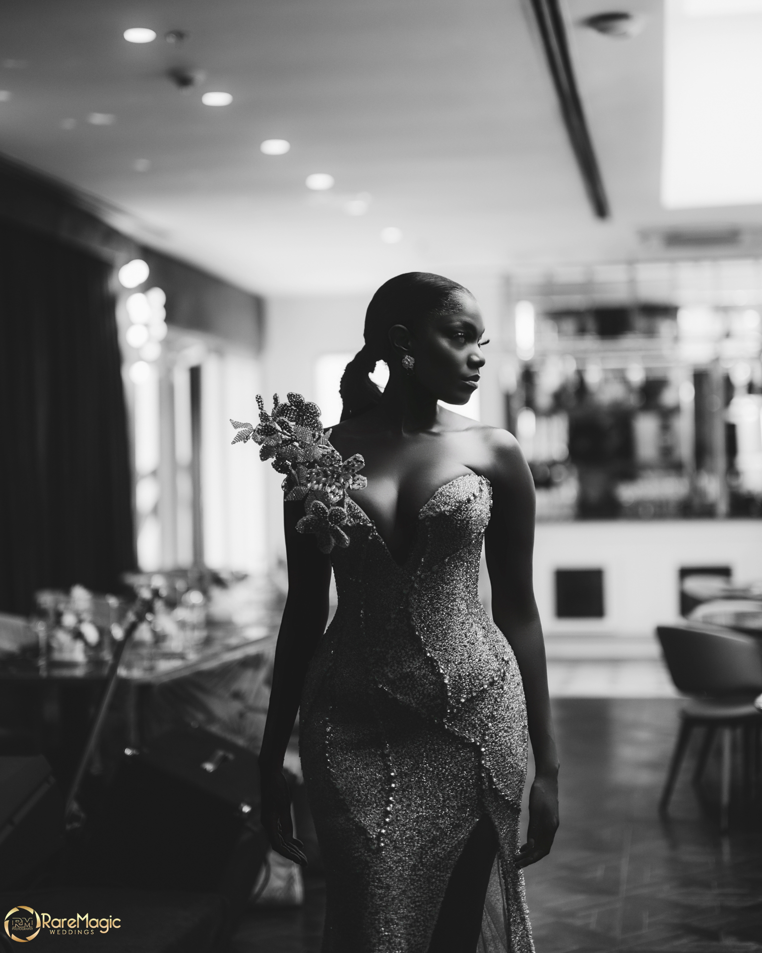 Black and white portrait of the bride in a shimmering gown