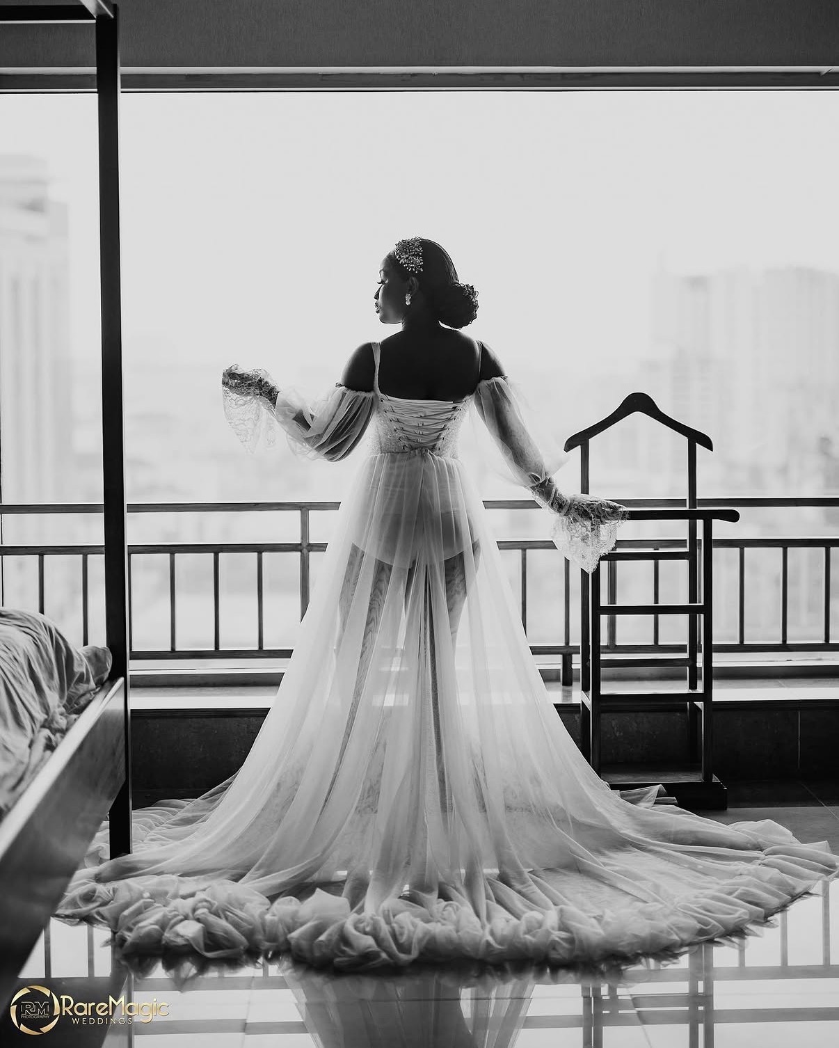 Bride in tulle gown overlooking the city