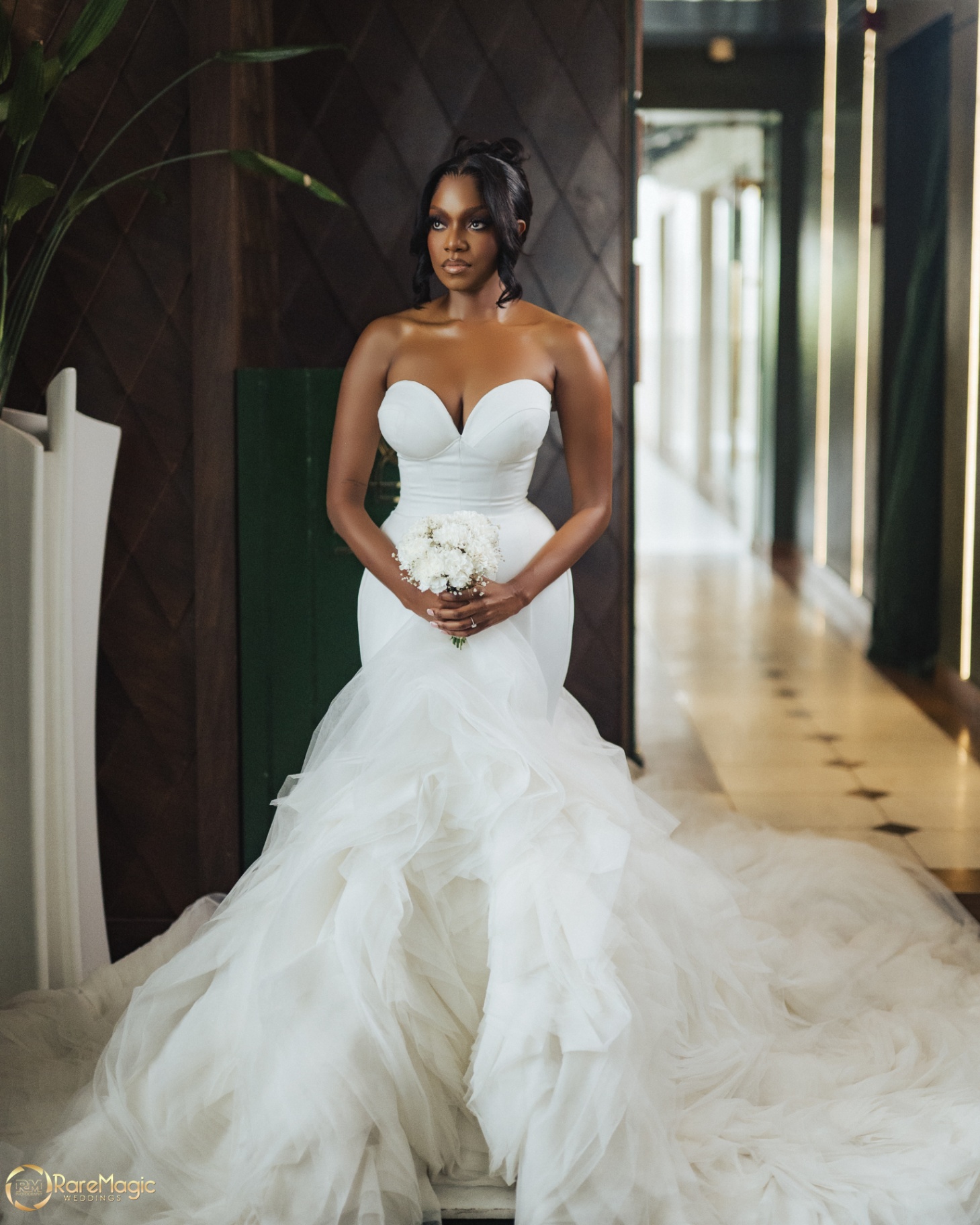 Bride in mermaid gown with cascading tulle train