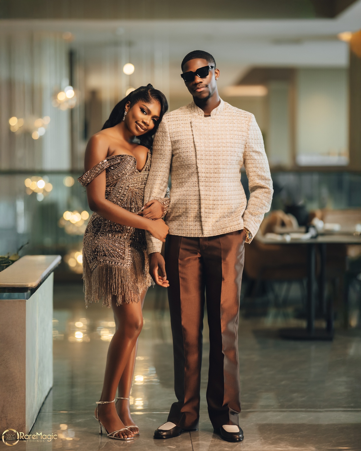 Couple portrait in evening looks with warm hotel lights