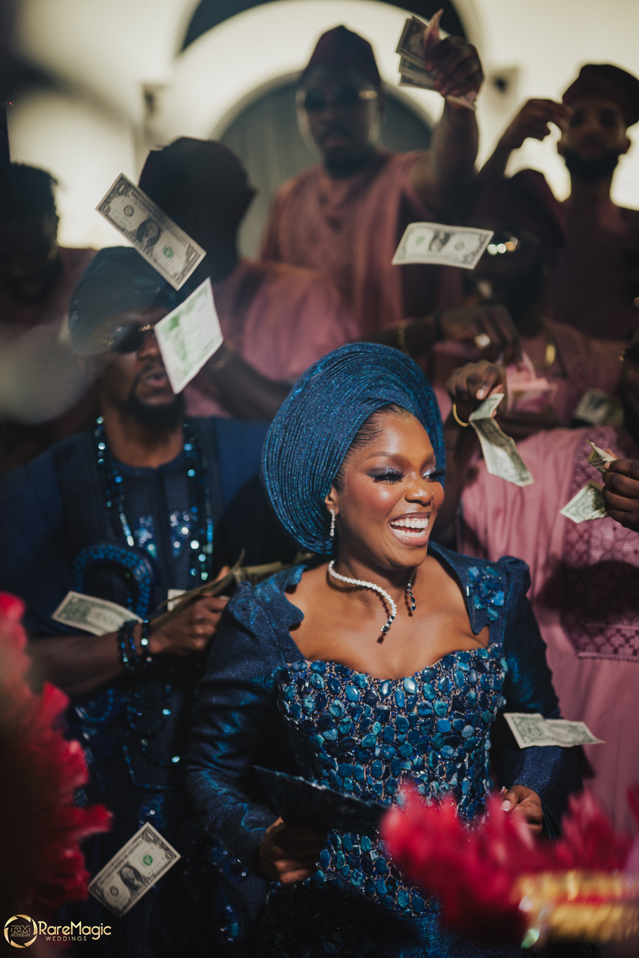 Bride showered with dollar bills during the traditional spraying