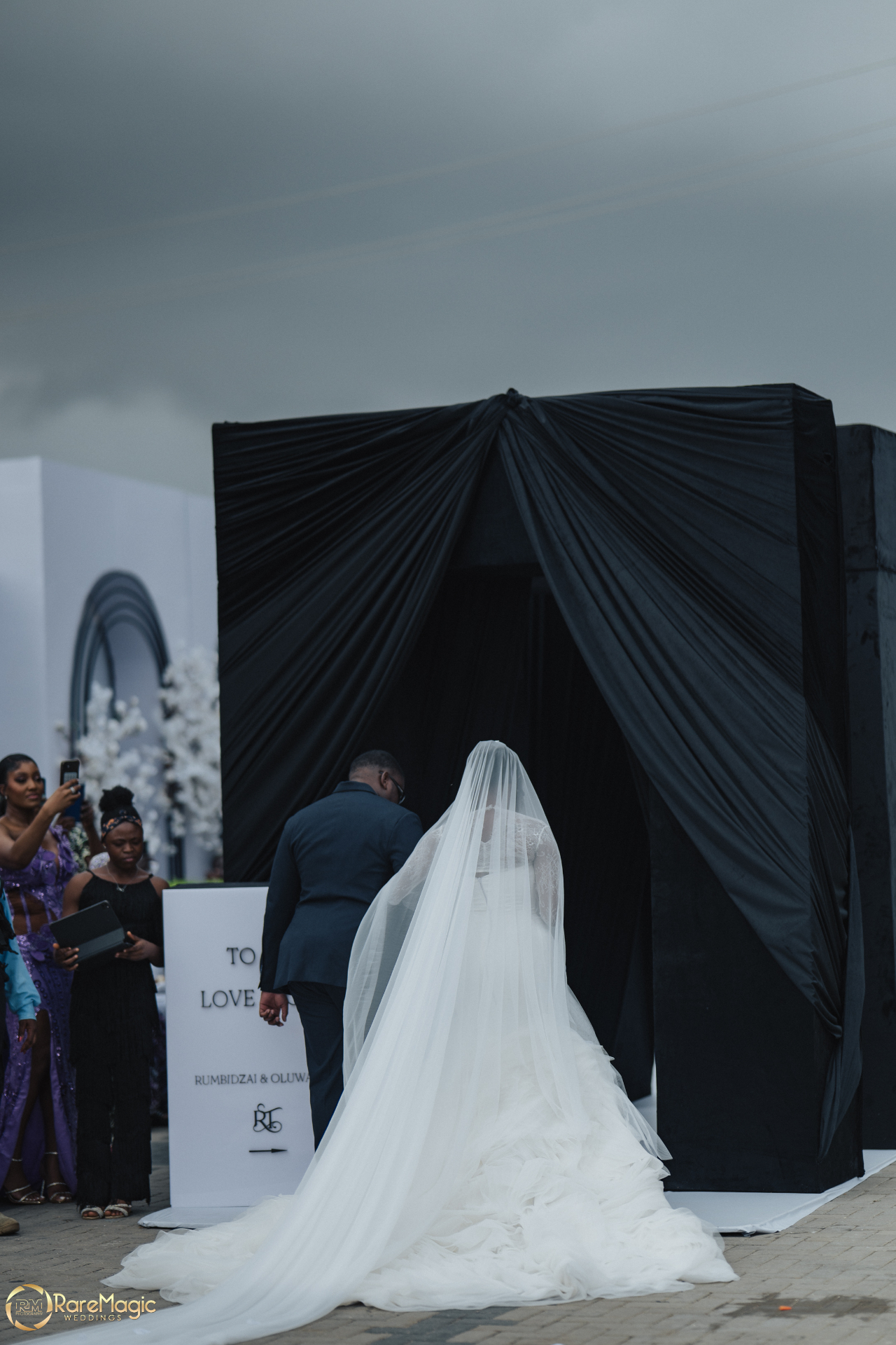 Bride and groom walking into the ceremony together