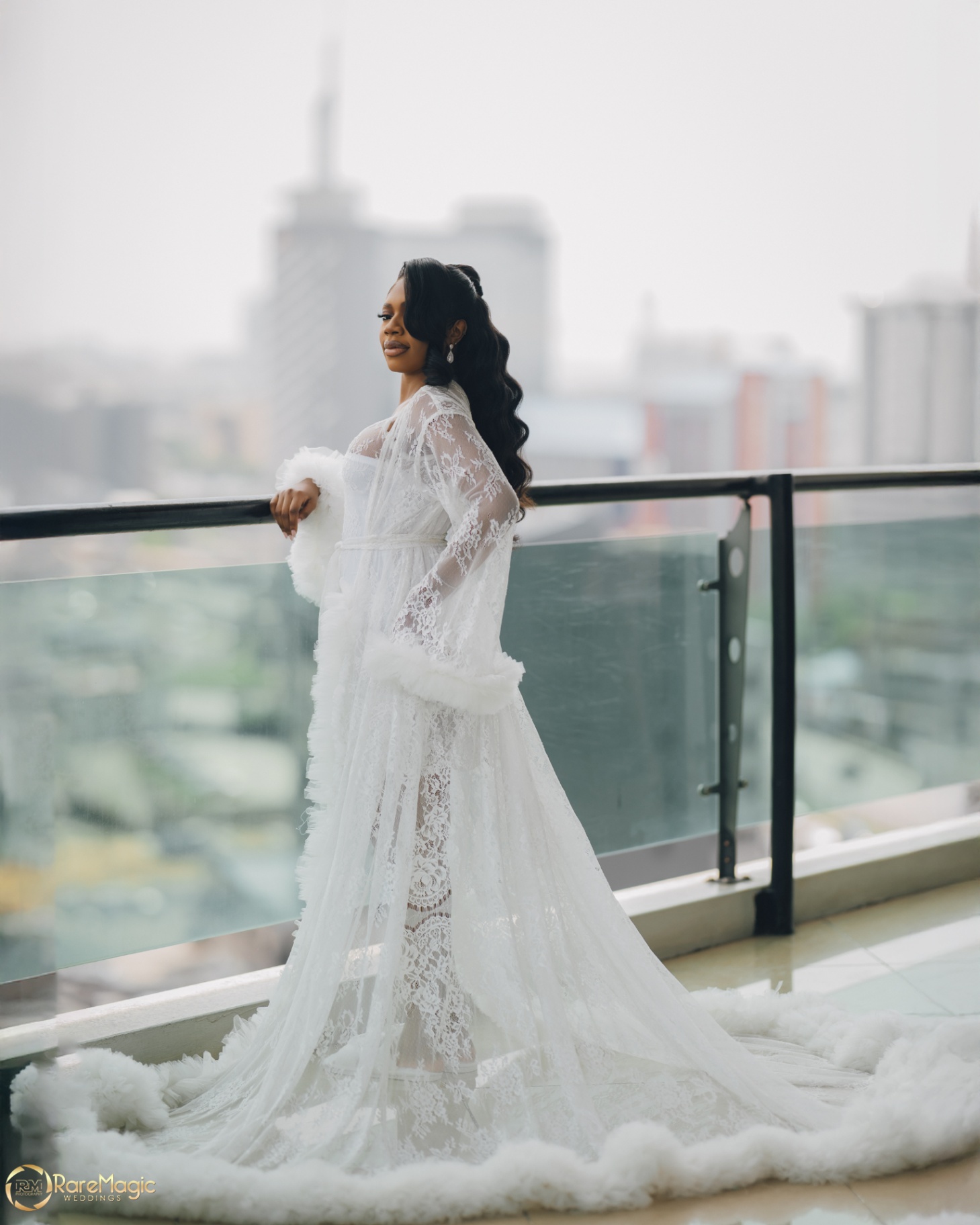 Full-length bridal portrait with sweeping lace robe train
