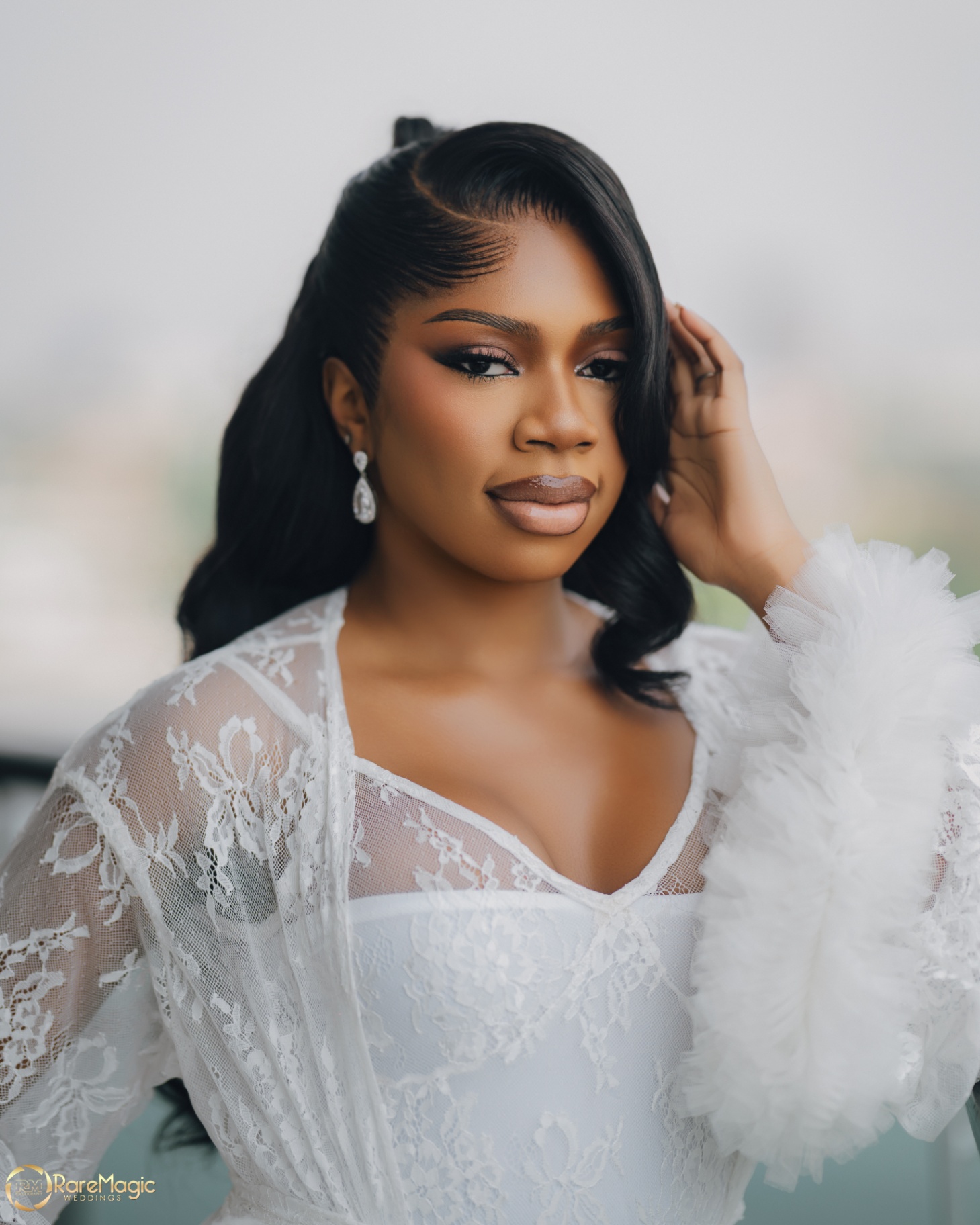 Bride portrait in a lace robe with soft morning light